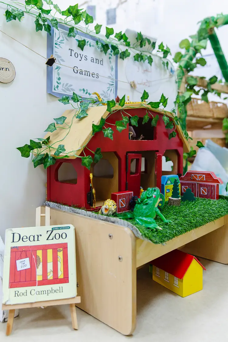 Toys and Games corner with farm and Dear Zoo book